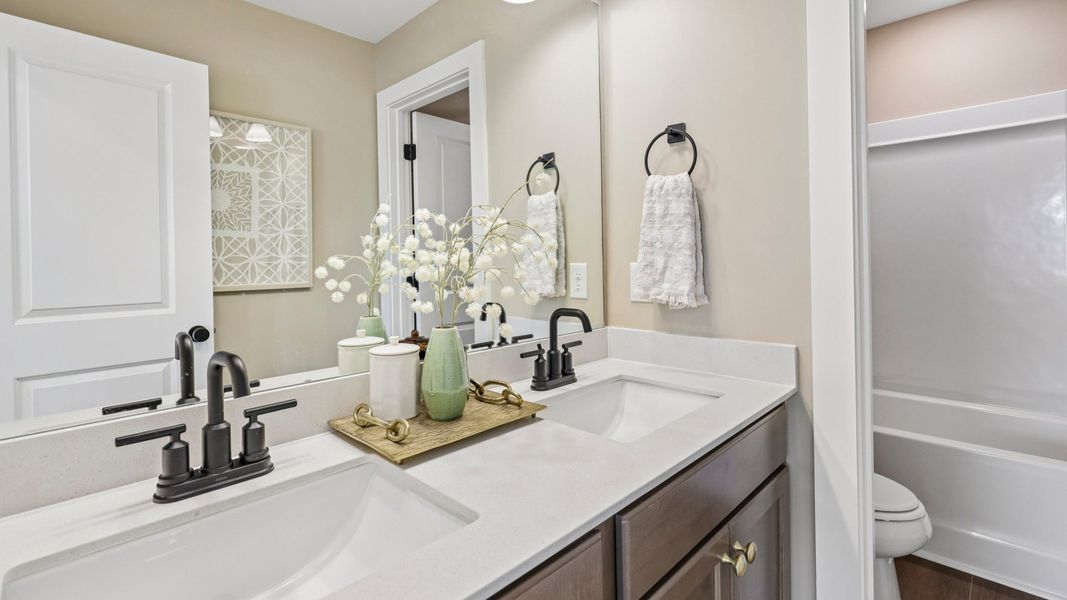 Secondary spacious bathroom with dual vanity Secondary spacious bathroom with dual vanity
