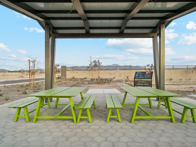 A group of tables and chairs outside.