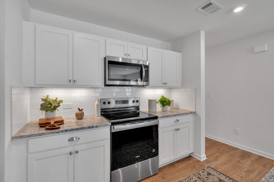 Furnished interior in a model home at Village Green in Adairsville (Image 17).