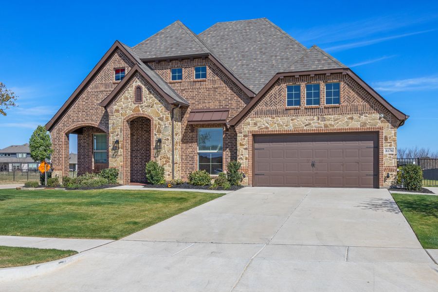 Front exterior of a home in the Abe's Landing community, located in Granbury, TX (Image 2).