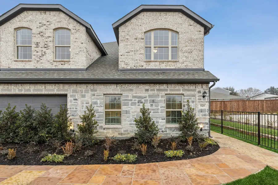 Front exterior of a home in the Main Street Village community, located in Mansfield, TX (Image 2). Front exterior of a home in the Main Street Village community, located in Mansfield, TX (Image 2).