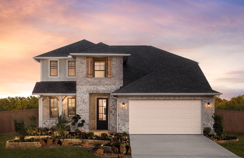 Front exterior of a home in the Sunterra community, located in Katy, TX (Image 4).