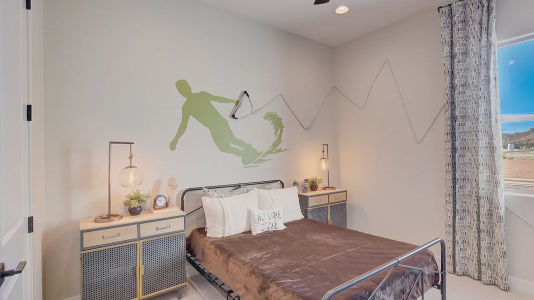 Elegant surfer motif and chic fixtures define this bedroom's high-end style in Arroyo Seco's Palazzo.