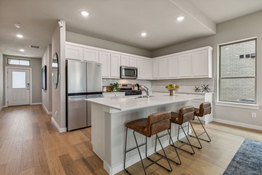 REPRESENTATIVE PHOTO – Kitchen in a Tesoro at Chisholm Trail Ranch new home in Crowley TX by Trophy Signature Homes