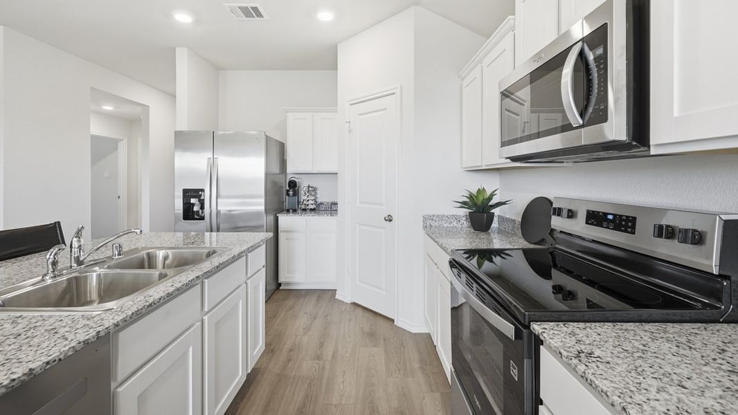 Furnished interior in a model home at Sweetwater Springs in Sherman (Image 5).