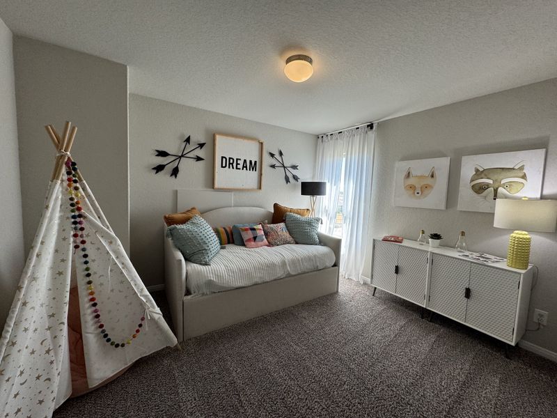 A cozy kids' room with a cute teepee, daybed, playful wall art, and soft lighting for a charming atmosphere.