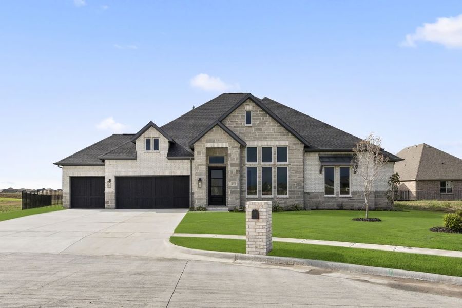 Front exterior of a home in the Heath Golf and Yacht Club community, located in Rockwall, TX (Image 27).