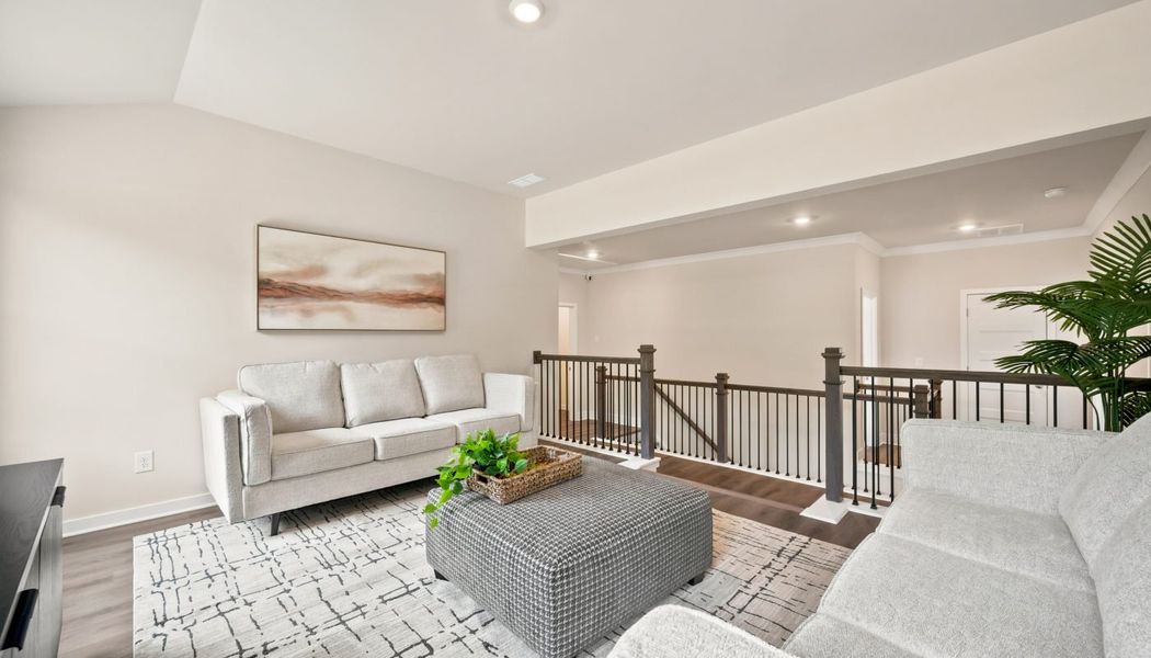 Furnished interior in a model home at Fowler Farms in Auburn (Image 129).