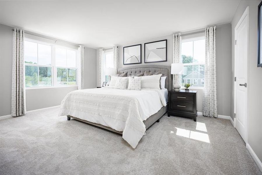 Spacious owner’s suite with room to relax, unwind, and enjoy a private bath retreat
