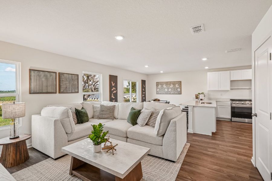 A living room with a white couch. A living room with a white couch.