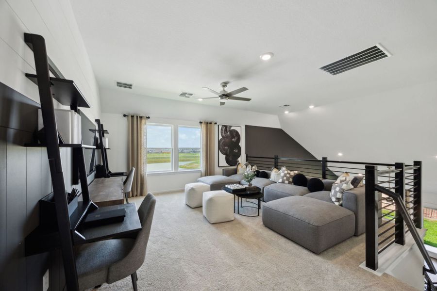 Furnished interior in a model home at Windcress in Cove (Image 14).