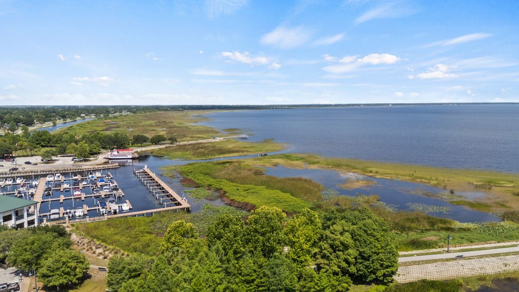 Aerial view of St. Cloud Marina with boat docks and scenic Lake Tohopekaliga shoreline near Cyrene at Harmony. Aerial view of St. Cloud Marina with boat docks and scenic Lake Tohopekaliga shoreline near Cyrene at Harmony.
