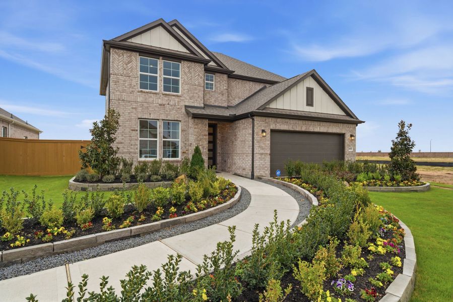 A house with a garden in front. A house with a garden in front.