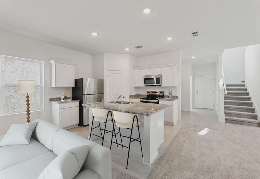 Furnished interior in a model home at Hawks Run in Kissimmee (Image 6).