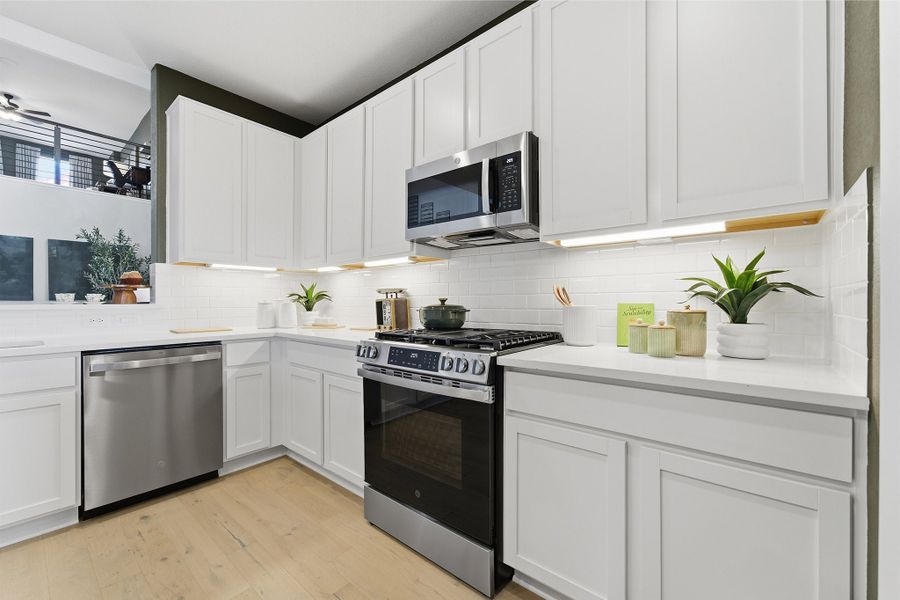 Furnished interior in a model home at Infinity Square in Kyle (Image 21).