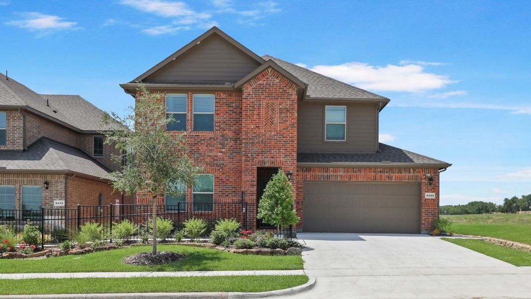 Front exterior of a home in the The Landing at Hidden Lakes community, located in McKinney, TX (Image 2).