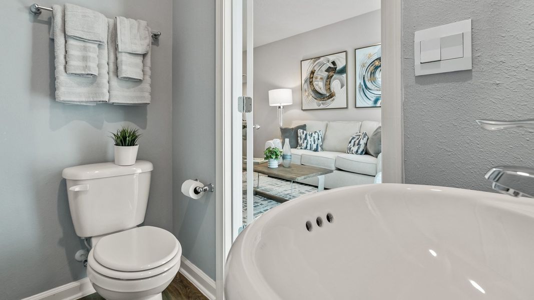 Furnished interior in a model home at Stokes Landing Express in St. Augustine (Image 13).