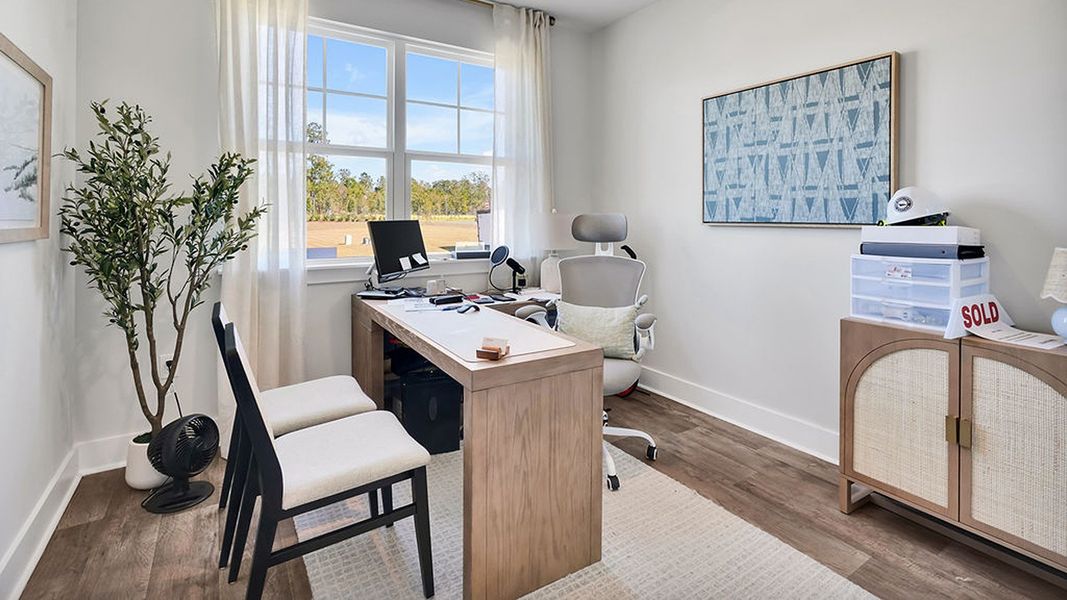 Furnished interior in a model home at Cedar Hill Landing in Navassa (Image 12).