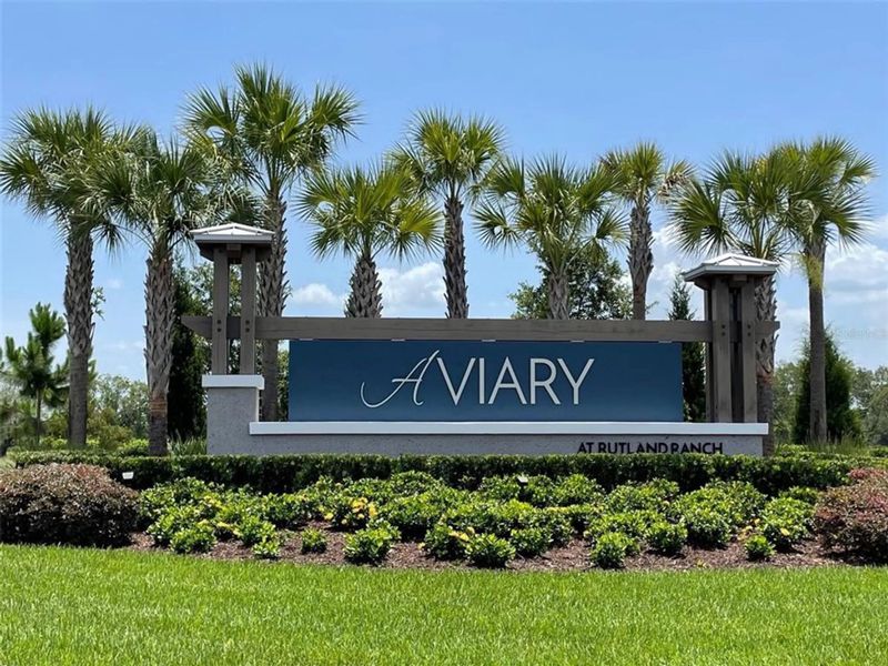 Main entrance to the Aviary at Rutland Ranch master-planned community in Parrish, FL, featuring its landmark signage (Image 6).