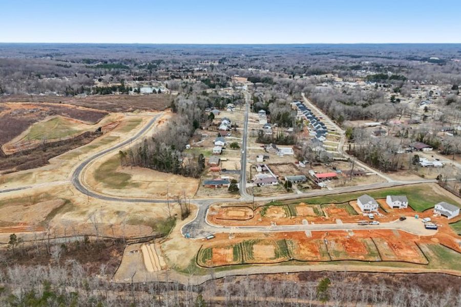 A landscape with a road and buildings. A landscape with a road and buildings.