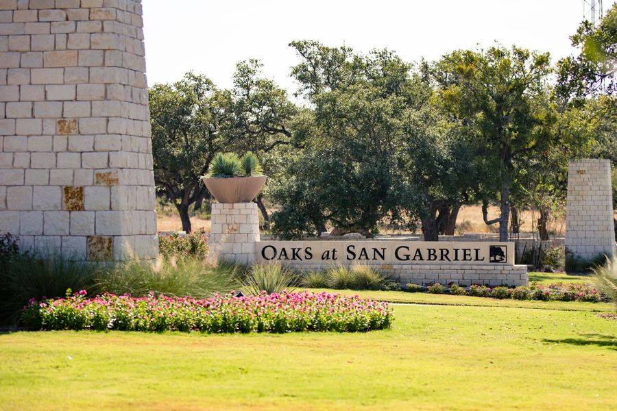 Entrance to the Oaks at San Gabriel community in Georgetown, TX, featuring signage and landscaping (Image 2).