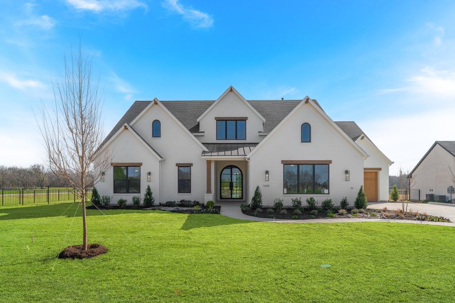 Front exterior of a home in the Enchanted Creek community, located in Lucas, TX (Image 2).