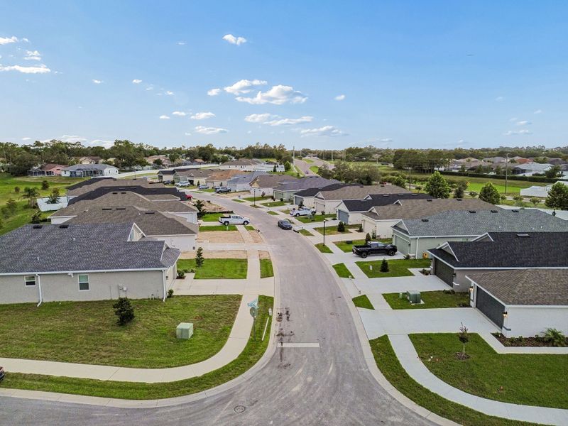 Aerial view of the Highland Hills community in Hudson, FL, showing layout and nearby surroundings (Image 11).