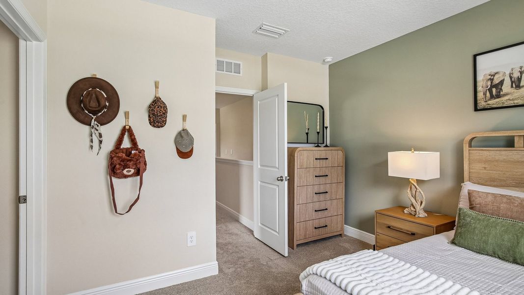 Furnished interior in a model home at Sanctuary at Citrus Park Townhomes in Tampa (Image 27).