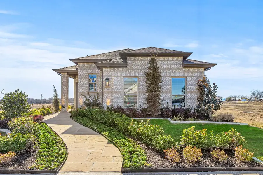 Front exterior of a home in the Creekside Ranch community, located in Blue Ridge, TX (Image 4).