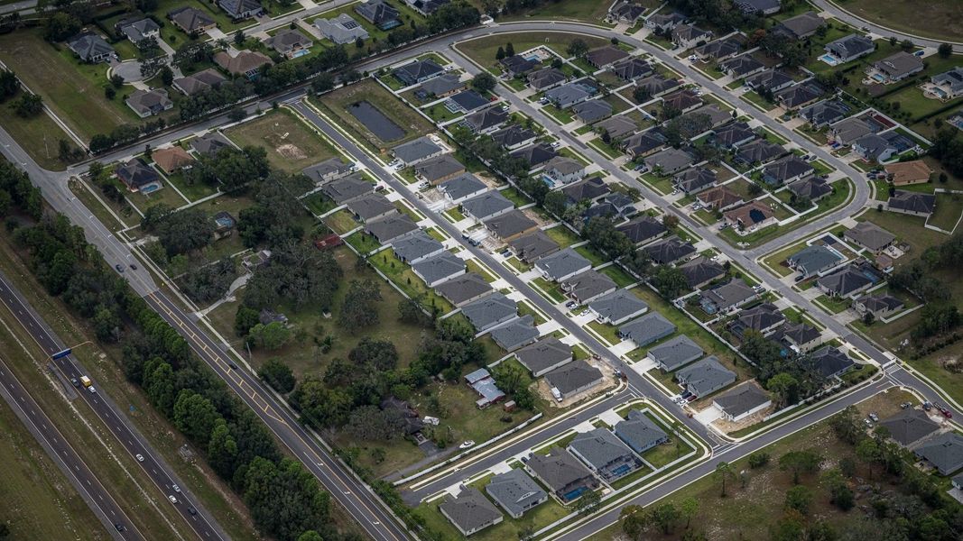 Aerial view of the Whiting Estates community in Spring Hill, FL, showing layout and nearby surroundings (Image 1). Aerial view of the Whiting Estates community in Spring Hill, FL, showing layout and nearby surroundings (Image 1).