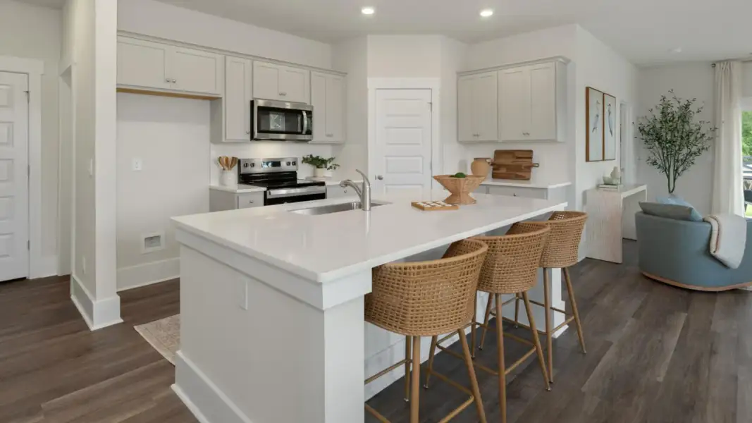 Furnished interior in a model home at The Retreat at Indigo Preserve Townhomes in Leland (Image 8).