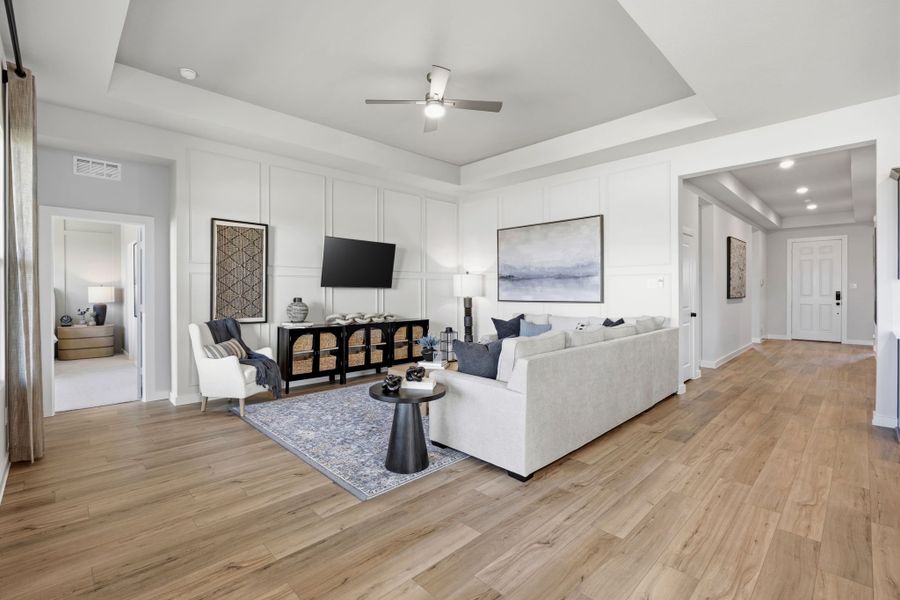 A living room with a wood floor. A living room with a wood floor.