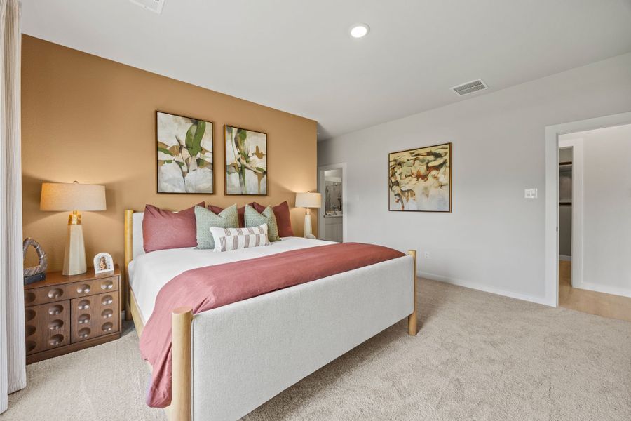 A bedroom with a bed and lamps. A bedroom with a bed and lamps.