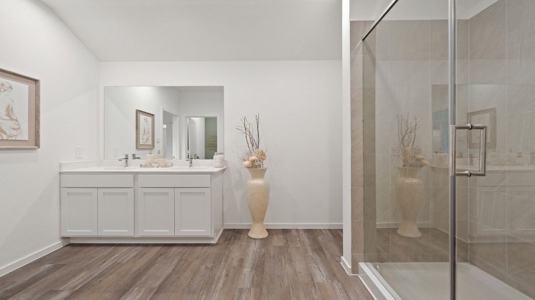 Furnished interior in a model home at Sunterra in Katy (Image 27).