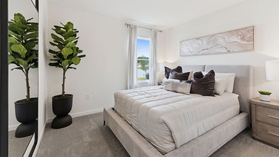 Furnished interior in a model home at Old Mission Cove in New Smyrna Beach (Image 9).