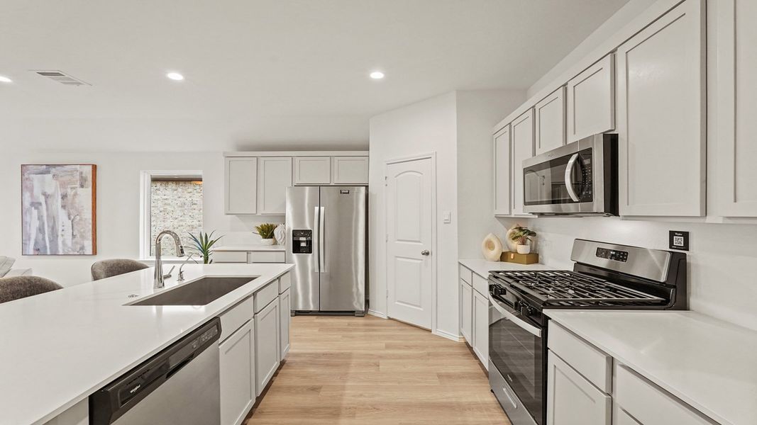 Furnished interior in a model home at Newport Pointe in Crosby (Image 23).