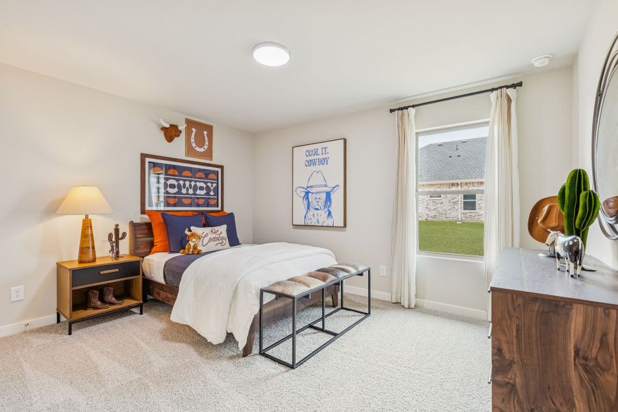 Bedroom in the Hayden home plan by Trophy Signature Homes - REPRESENTATIVE PHOTO