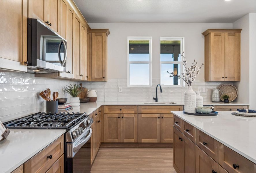 A kitchen with wooden cabinets. A kitchen with wooden cabinets.