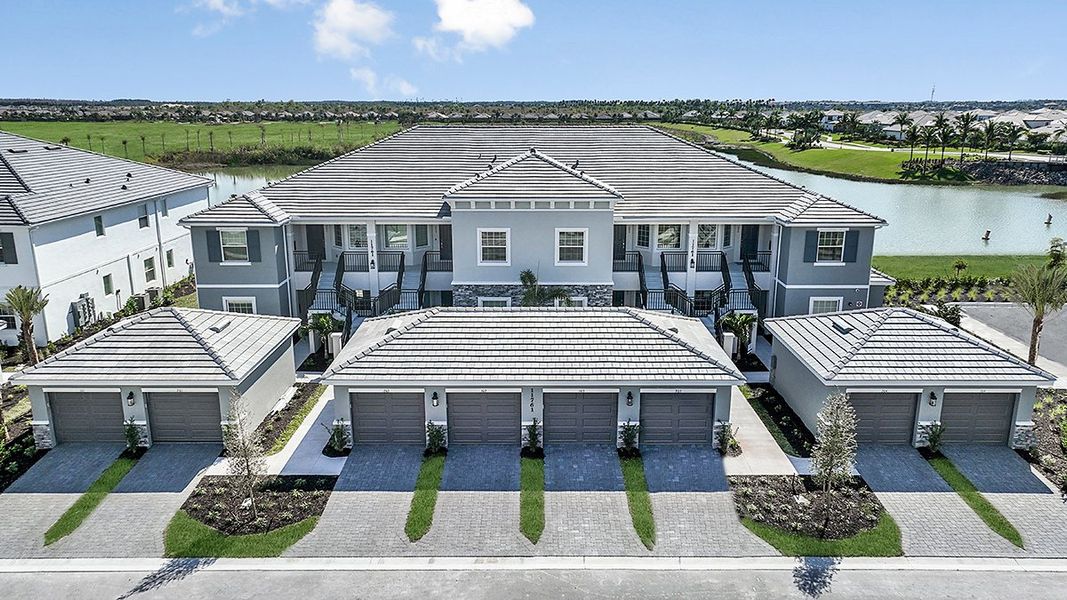 Front exterior of a home in the Esplanade Lake Club Condos community, located in Fort Myers, FL (Image 36).