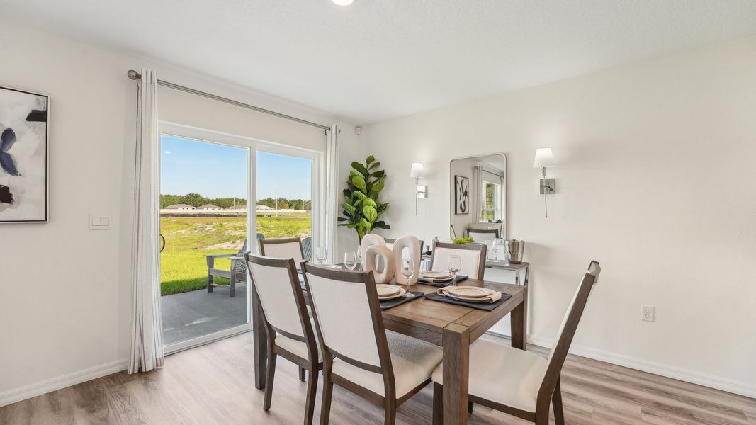 Furnished interior in a model home at Fletcher Trace in Alachua (Image 10).