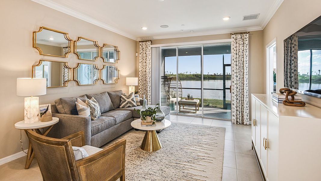 Furnished interior in a model home at Esplanade Lake Club Condos in Fort Myers (Image 43).