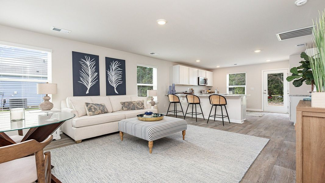 Furnished interior in a model home at Silver Oaks in Ocean Isle Beach (Image 9).