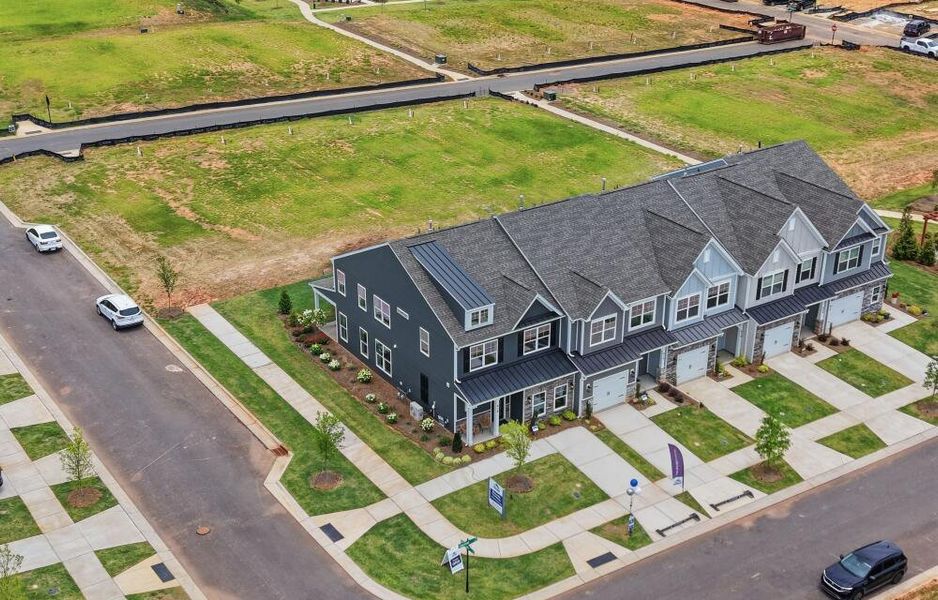 Aerial view of the Blythe Mill Townhomes community in Waxhaw, NC, showing layout and nearby surroundings (Image 1). Aerial view of the Blythe Mill Townhomes community in Waxhaw, NC, showing layout and nearby surroundings (Image 1).