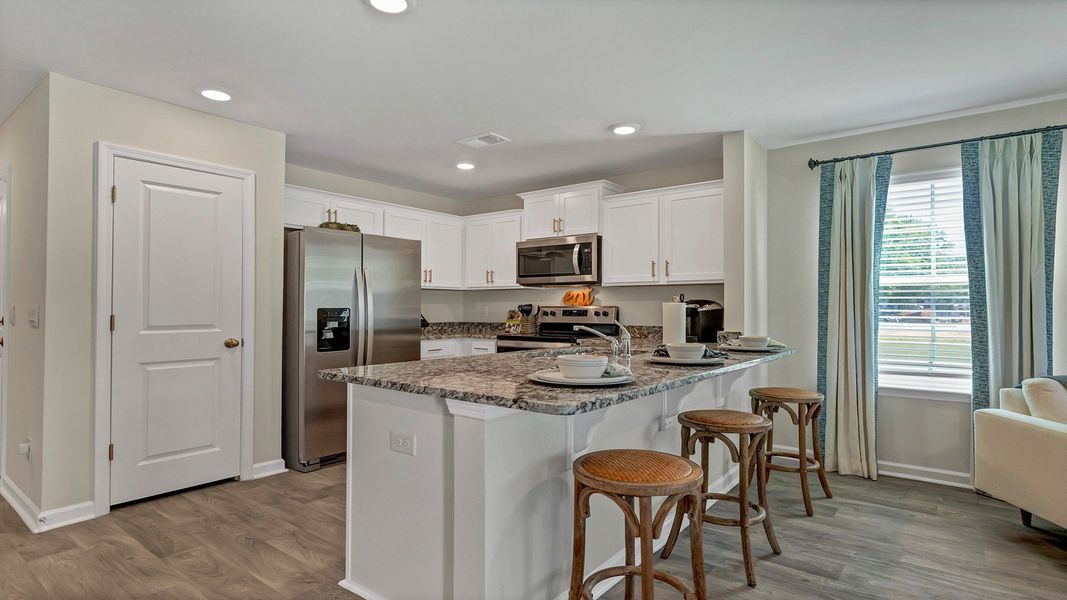 Furnished interior in a model home at Hunter's Branch Townhomes in Hopkins (Image 8).