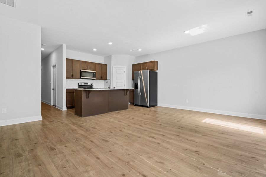 Furnished interior in a model home at Marin Woods Townhomes in Smithfield (Image 10).
