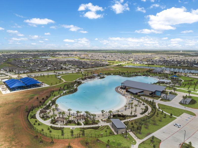 A river with a bridge and buildings.