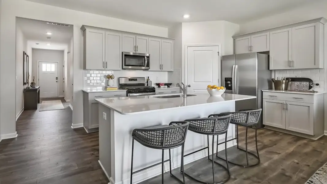 Furnished interior in a model home at The Landing at Winston Pointe in Clayton (Image 3). Furnished interior in a model home at The Landing at Winston Pointe in Clayton (Image 3).
