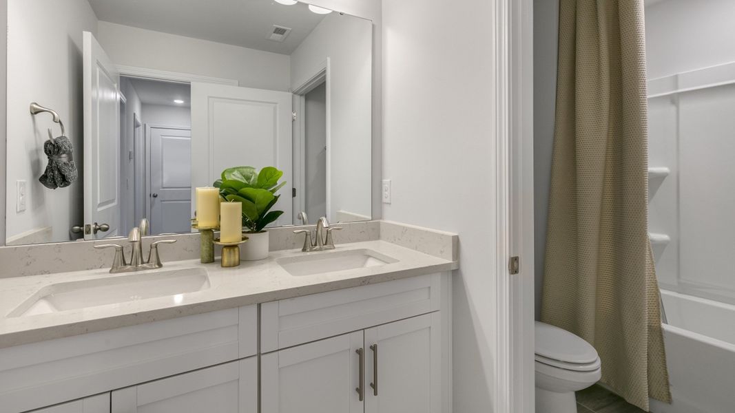 Furnished interior in a model home at The Meadows at Kinsley in Jamestown (Image 16).