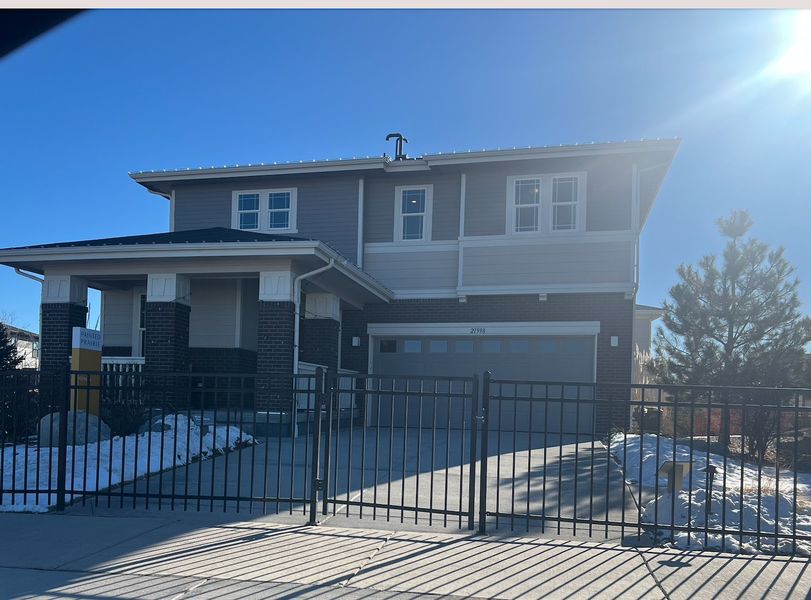 A modern two-story with brick accents in Painted Prairie by KB Home (Aurora, CO).