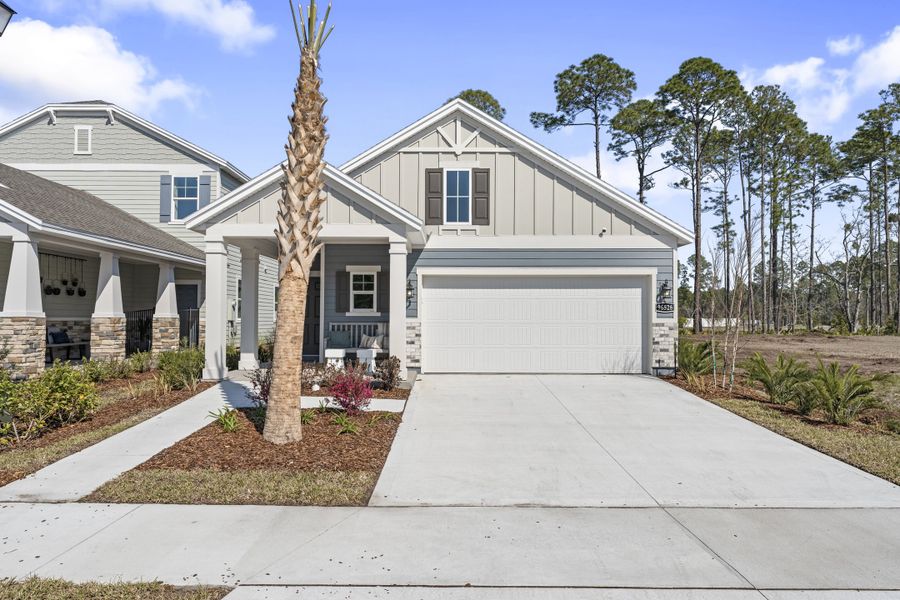 A white house with a garage. A white house with a garage.